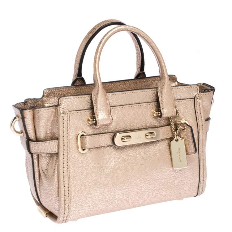 Pre Owned Coach Metallic Rose Gold Leather Swagger 27 Carryall Top Handle Bag