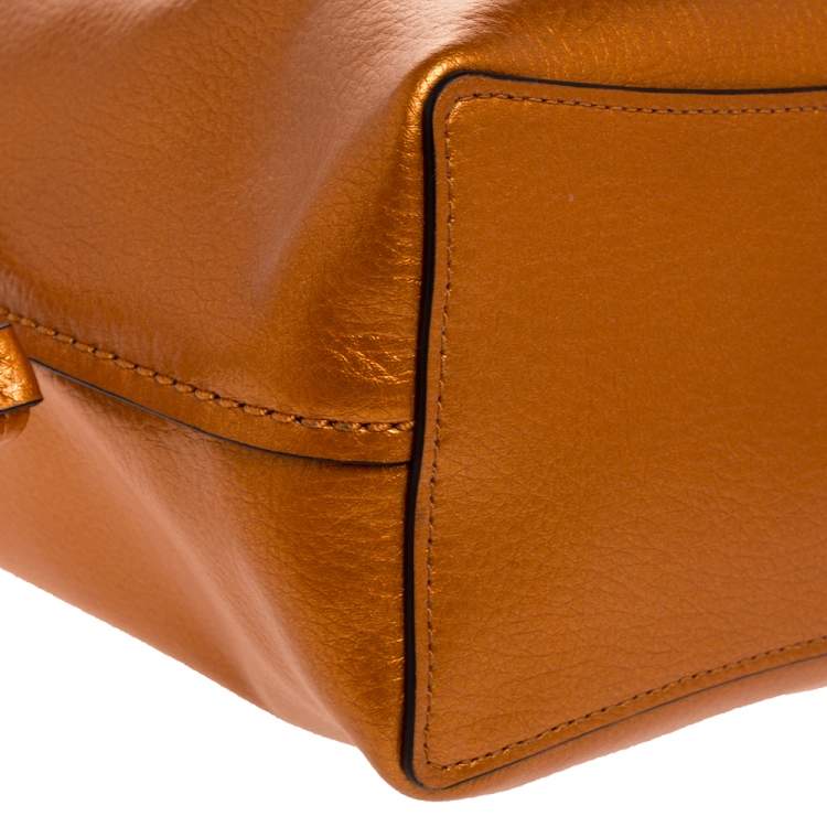 Pre Owned Coach Metallic Orange Leather Drawstring Crossbody Bag
