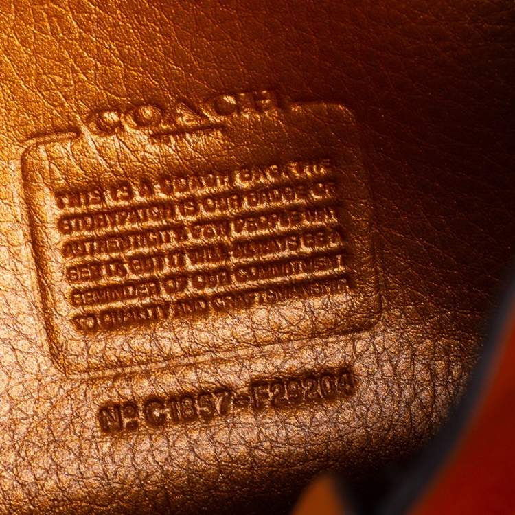 Pre Owned Coach Metallic Orange Leather Drawstring Crossbody Bag