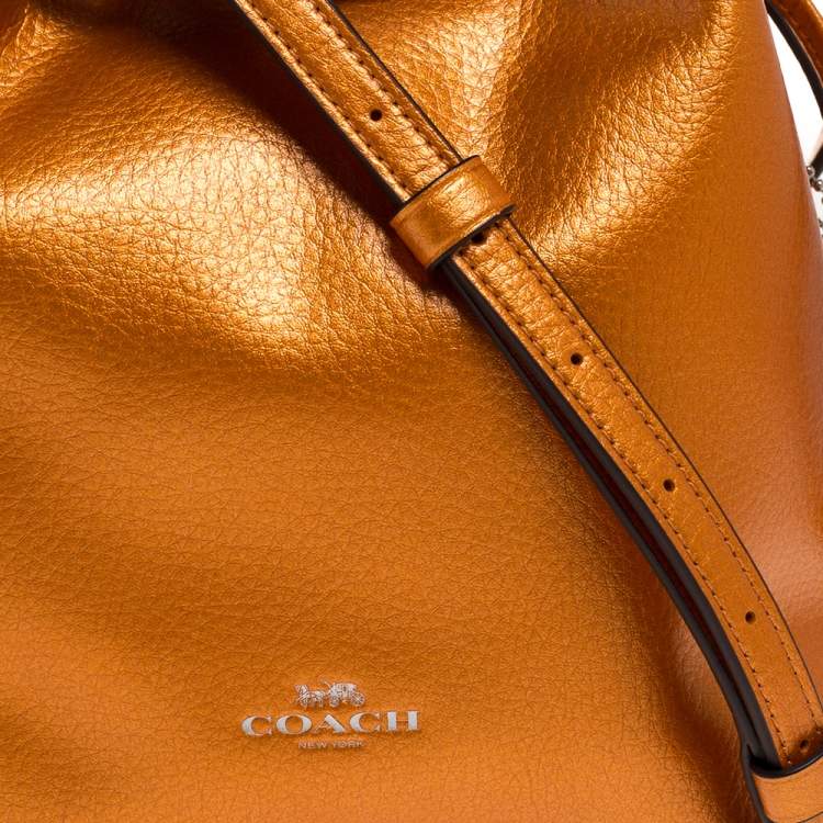 Pre Owned Coach Metallic Orange Leather Drawstring Crossbody Bag