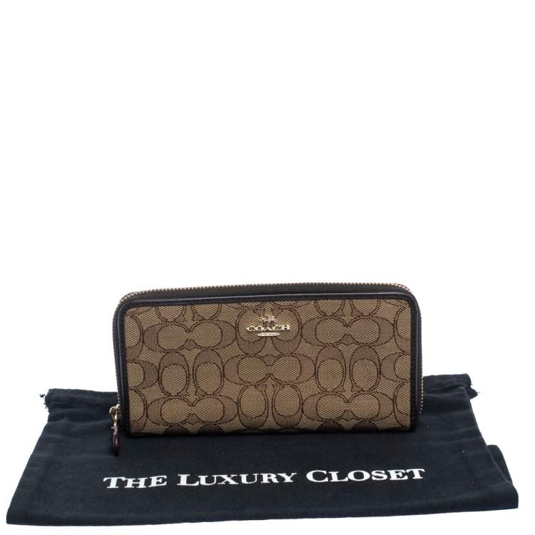 Pre Owned Coach Beige/Brown Signature Canvas and Leather Zip Around Wallet