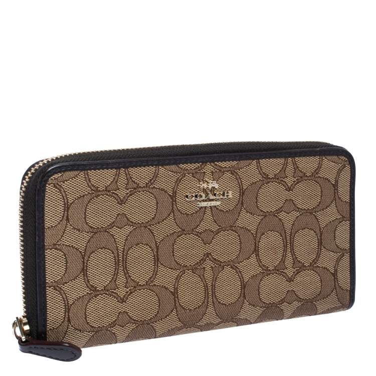 Pre Owned Coach Beige/Brown Signature Canvas and Leather Zip Around Wallet