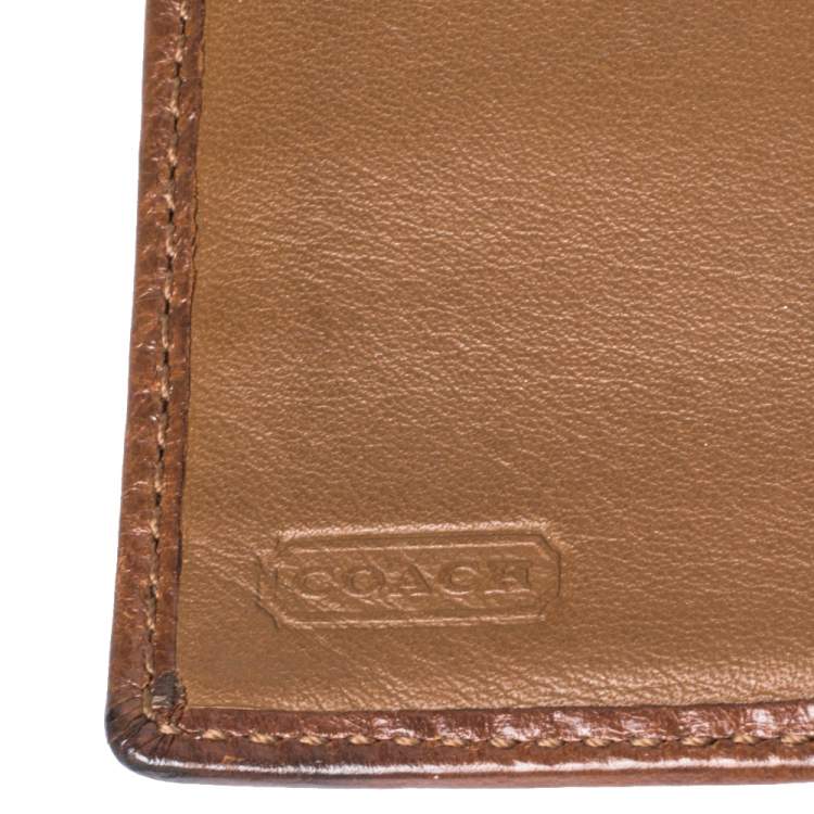 Pre Owned Coach Brown Signature Canvas and Leather Buckle Flap Compact Wallet