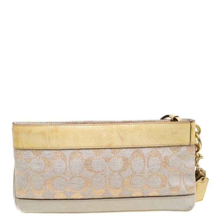 Pre Owned Coach Beige/Cream Signature Canvas and Leather Turnlock Pocket Wristlet Clutch