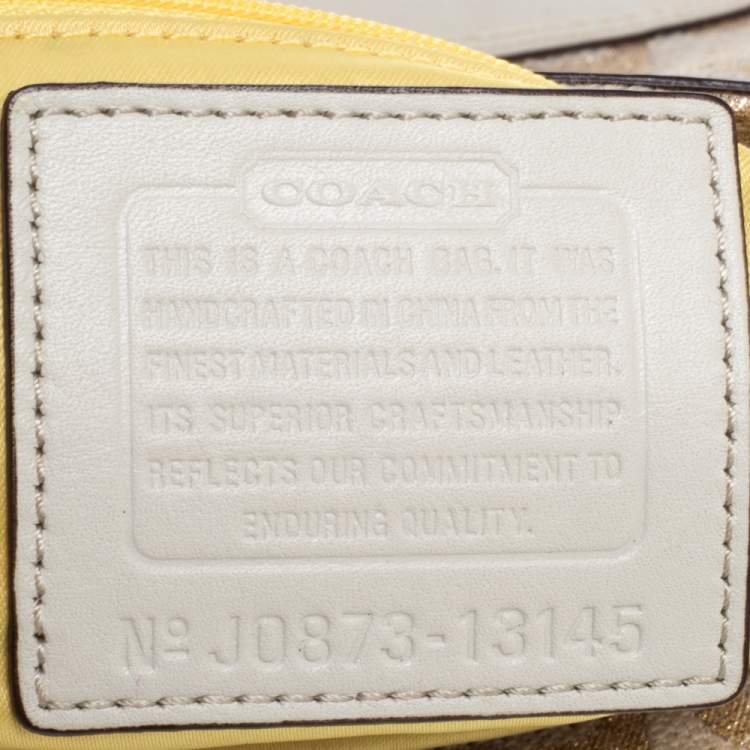 Pre Owned Coach Beige/Cream Signature Canvas and Leather Turnlock Pocket Wristlet Clutch