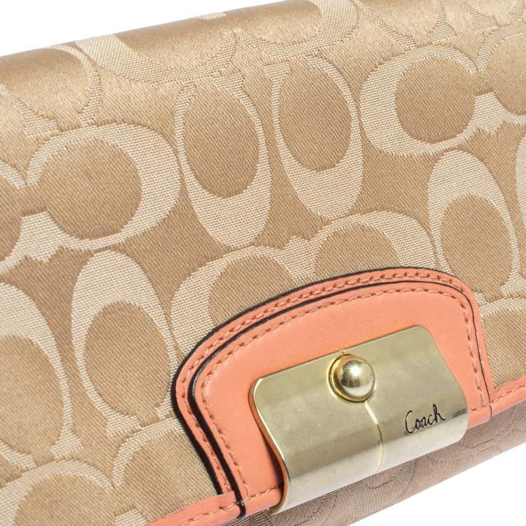 Pre Owned Coach Beige/Orange Signature Canvas and Leather Wristlet Clutch  