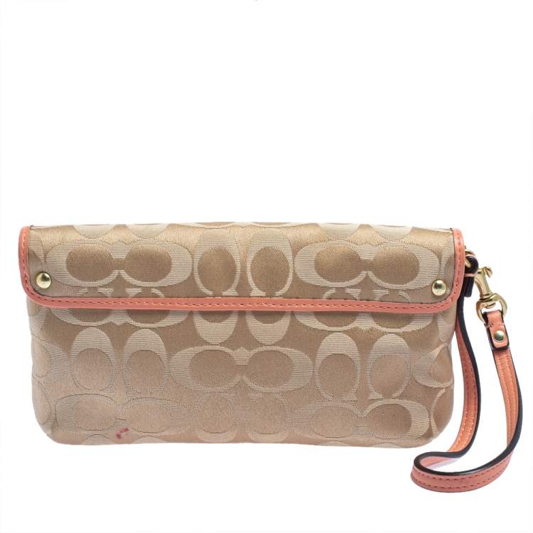 Pre Owned Coach Beige/Orange Signature Canvas and Leather Wristlet Clutch  