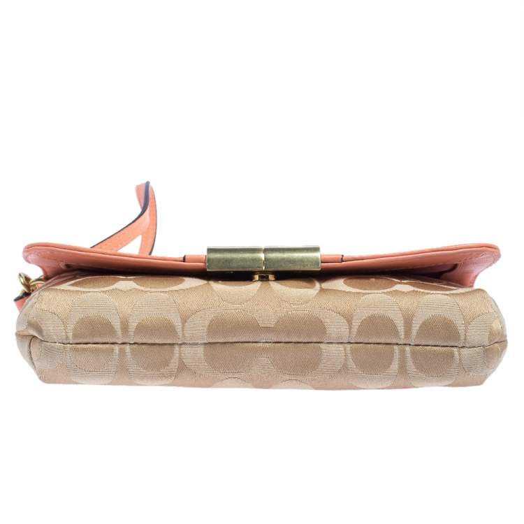 Pre Owned Coach Beige/Orange Signature Canvas and Leather Wristlet Clutch  