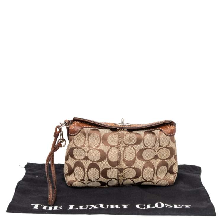 Pre Owned Coach Brown Signature Canvas and Leather Turnlock Wristlet
