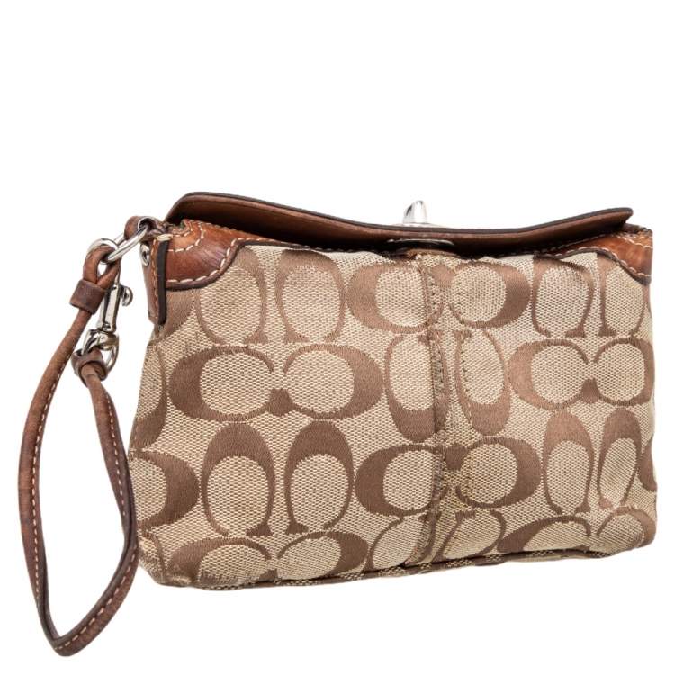 Pre Owned Coach Brown Signature Canvas and Leather Turnlock Wristlet
