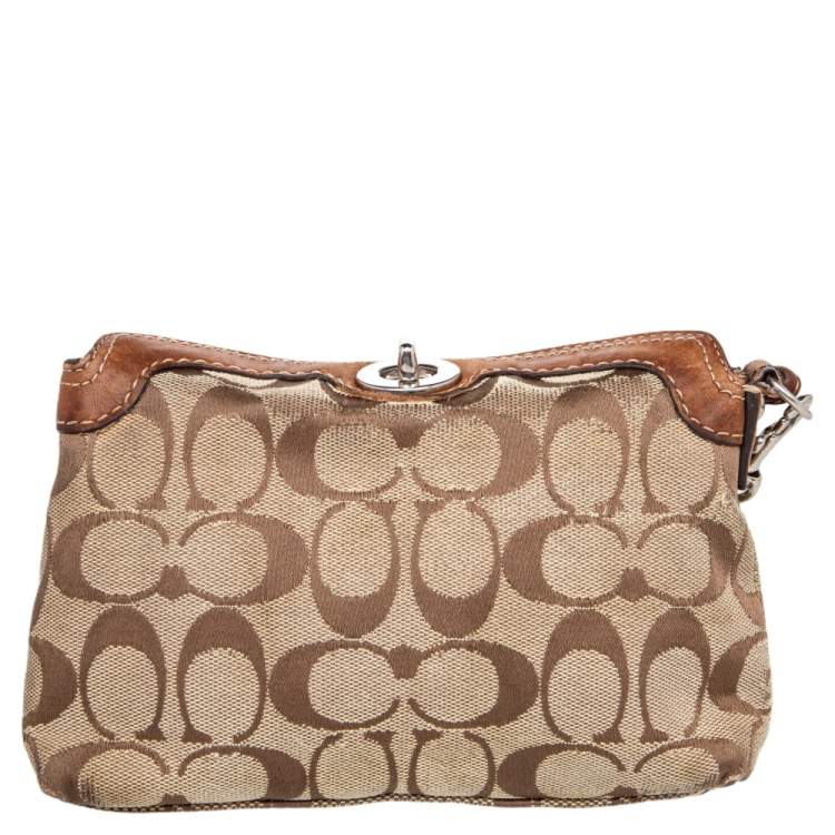 Pre Owned Coach Brown Signature Canvas and Leather Turnlock Wristlet