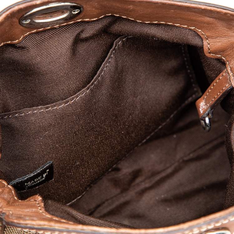 Pre Owned Coach Brown Signature Canvas and Leather Turnlock Wristlet