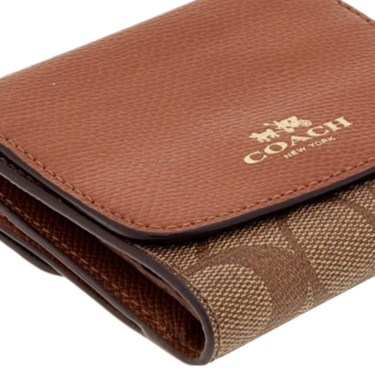 Pre Owned Coach Brown Signature Coated Canvas and Leather Trifold Wallet
