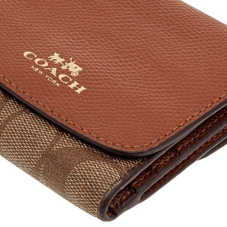 Pre Owned Coach Brown Signature Coated Canvas and Leather Trifold Wallet