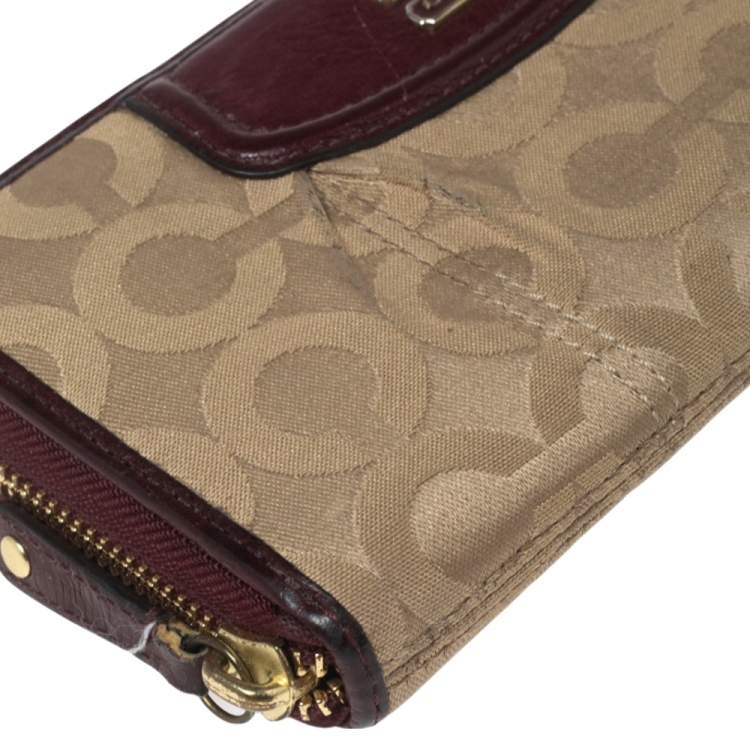 Pre Owned Coach Burgundy/Brown Op Art Fabric and Leather Madison Continental Wallet