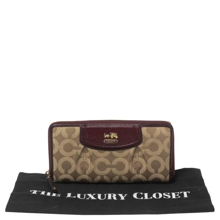 Pre Owned Coach Burgundy/Brown Op Art Fabric and Leather Madison Continental Wallet