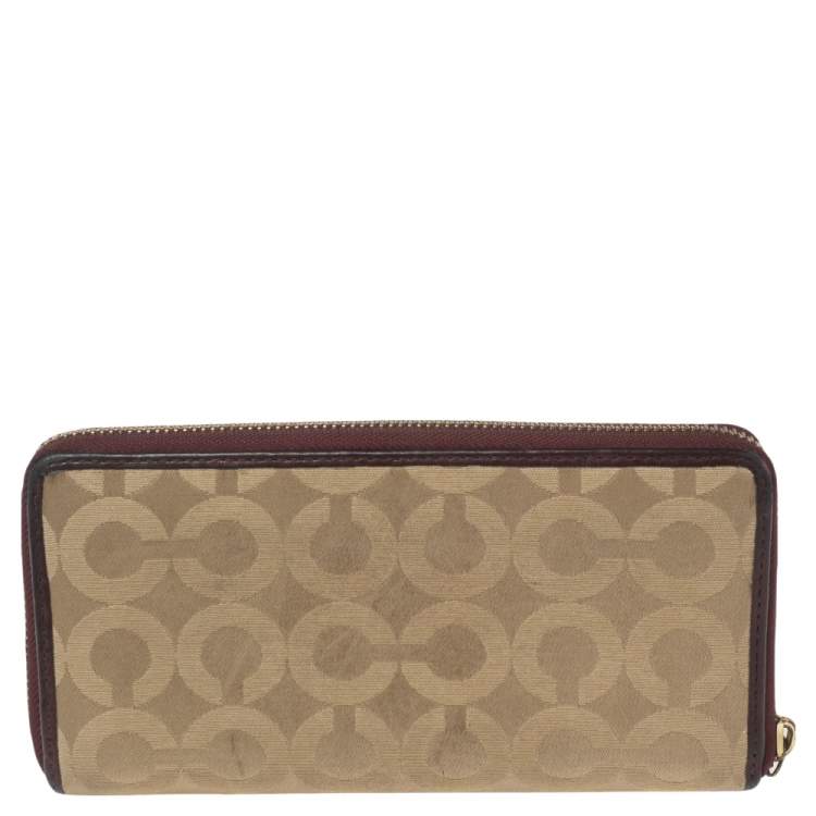 Pre Owned Coach Burgundy/Brown Op Art Fabric and Leather Madison Continental Wallet