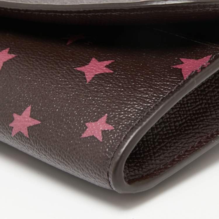 Pre Owned Coach Burgundy Stars Coated Canvas Continental Wristlet Wallet