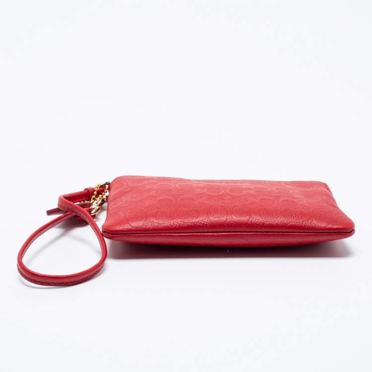 Pre Owned Coach Red Signature Embossed Leather Wristlet Clutch