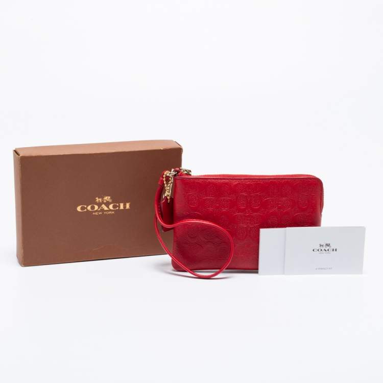 Pre Owned Coach Red Signature Embossed Leather Wristlet Clutch