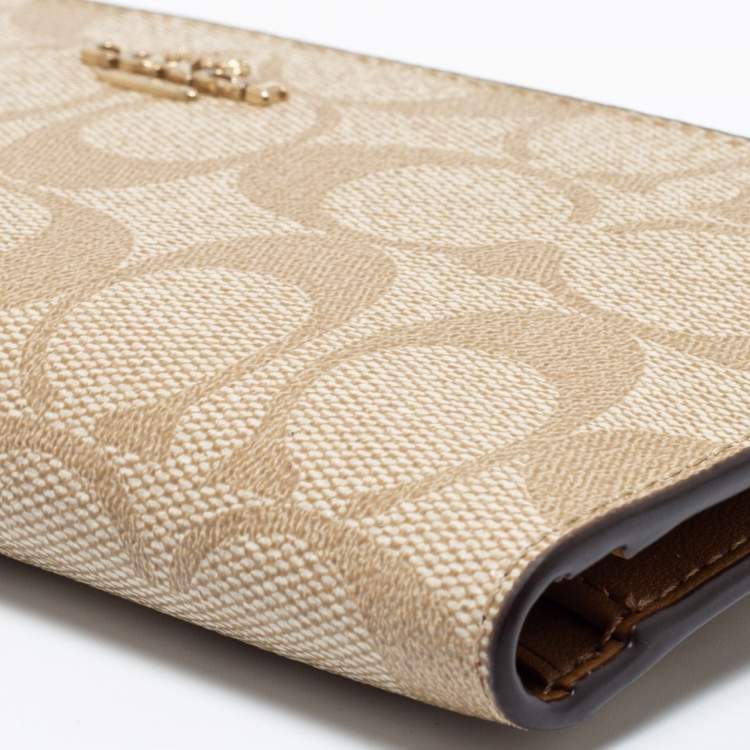Pre Owned Coach Beige Signature Coated Canvas Long Slim Bifold Wallet