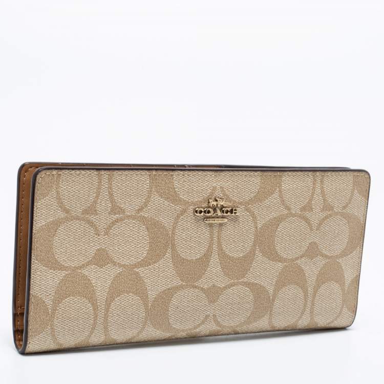 Pre Owned Coach Beige Signature Coated Canvas Long Slim Bifold Wallet