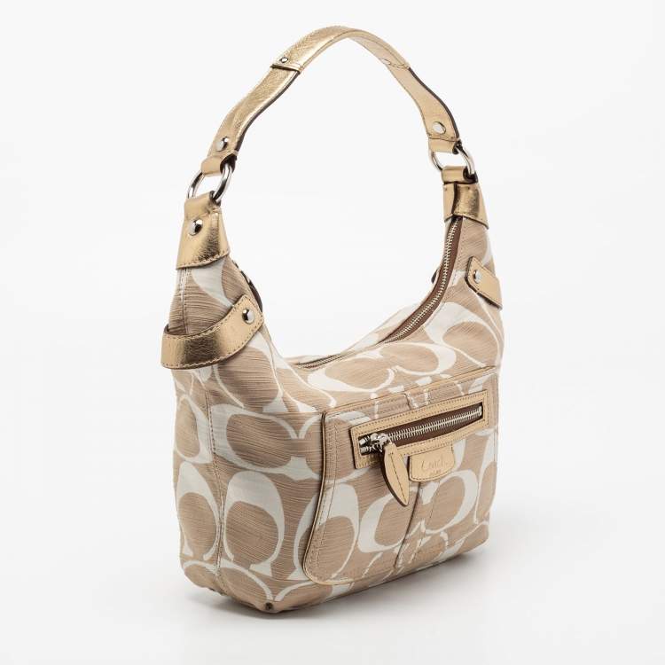 Pre Owned Coach Beige/White Signature Canvas Penelope Hobo