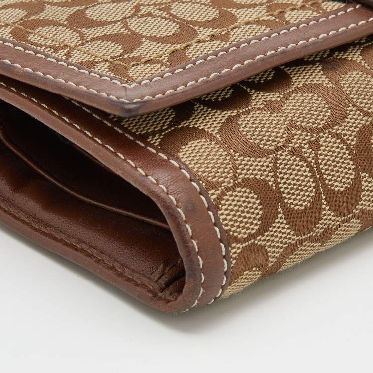 Pre Owned Coach Beige/Brown Signature Canvas and Leather Buckle Detail Continental Wallet