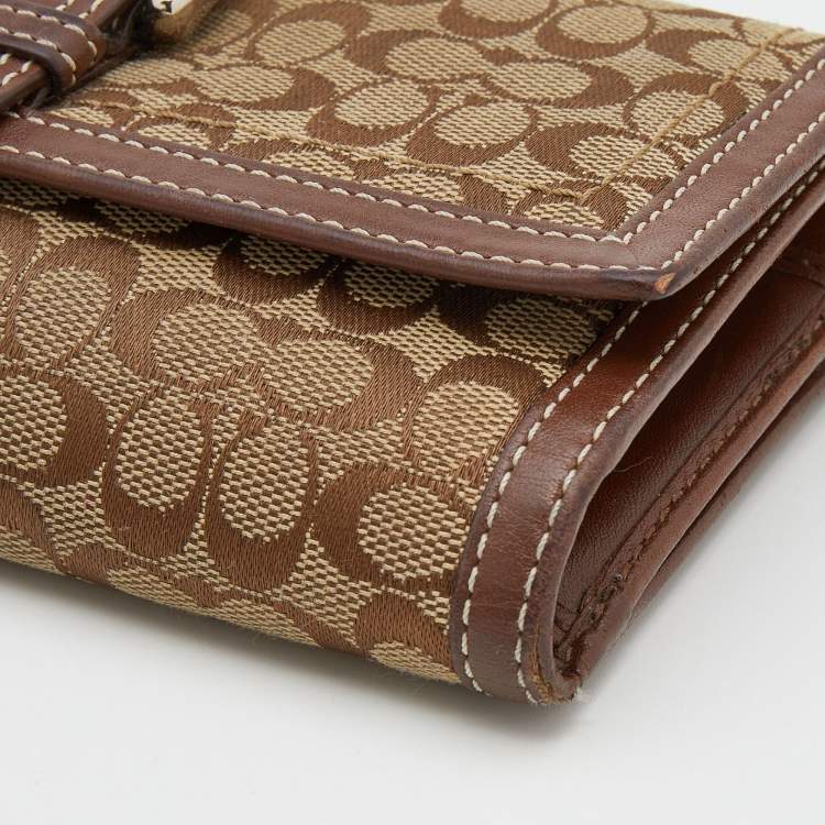 Pre Owned Coach Beige/Brown Signature Canvas and Leather Buckle Detail Continental Wallet