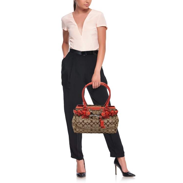 Pre Owned Coach Beige/Orange Signature Canvas and Leather Hampton Tote