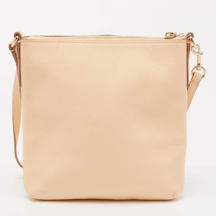 مملوكة مسبقًا Coach Peach Leather North South Swingpack Crossbody Bag