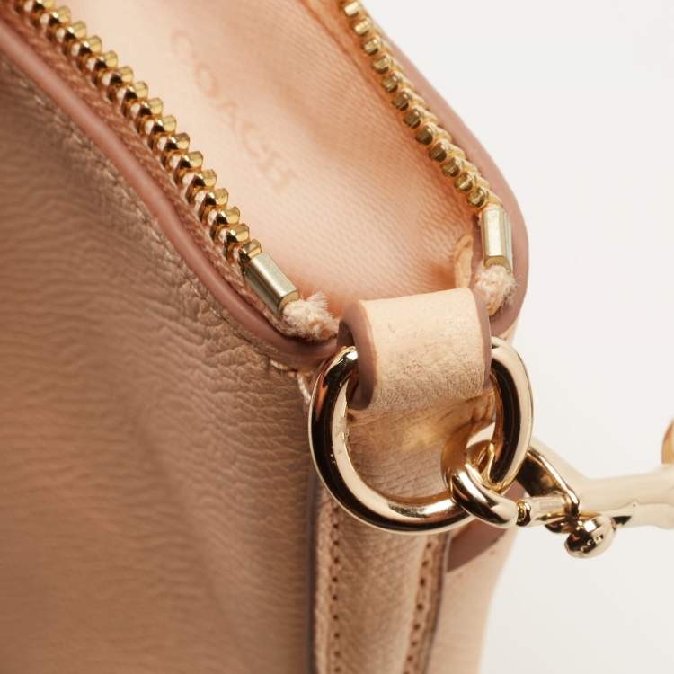مملوكة مسبقًا Coach Peach Leather North South Swingpack Crossbody Bag