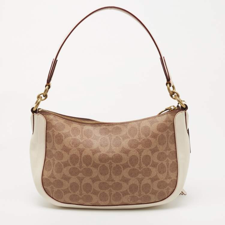 Pre Owned Coach Beige/Cream Signature Coated Canvas and Leather Sutton Hobo