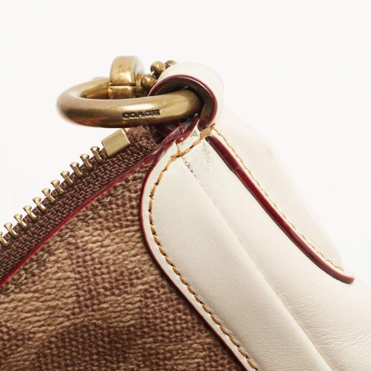 Pre Owned Coach Beige/Cream Signature Coated Canvas and Leather Sutton Hobo