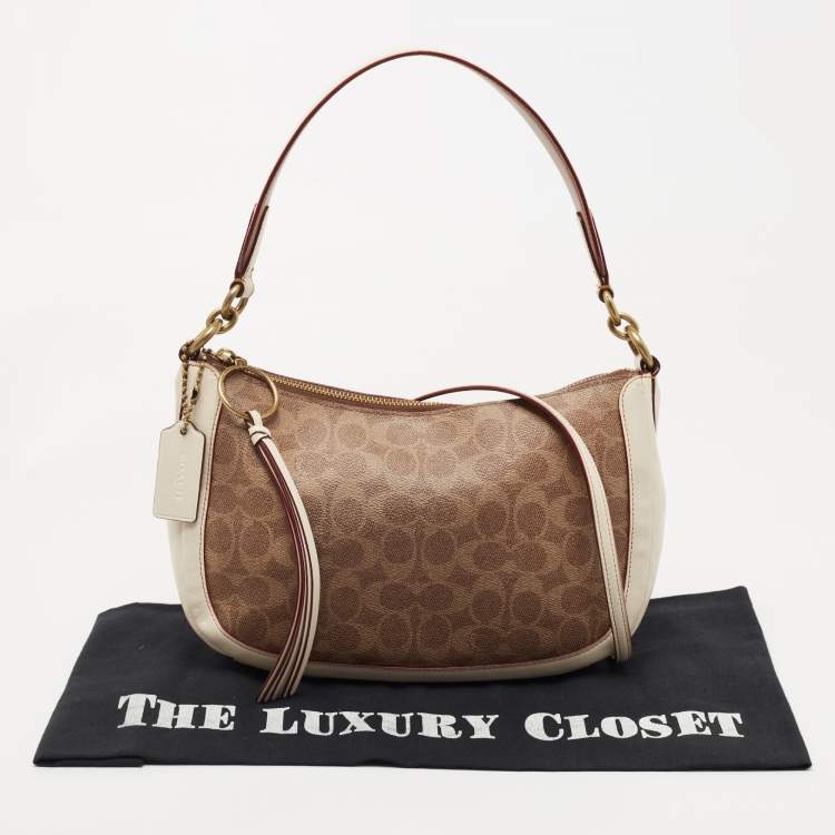 Pre Owned Coach Beige/Cream Signature Coated Canvas and Leather Sutton Hobo
