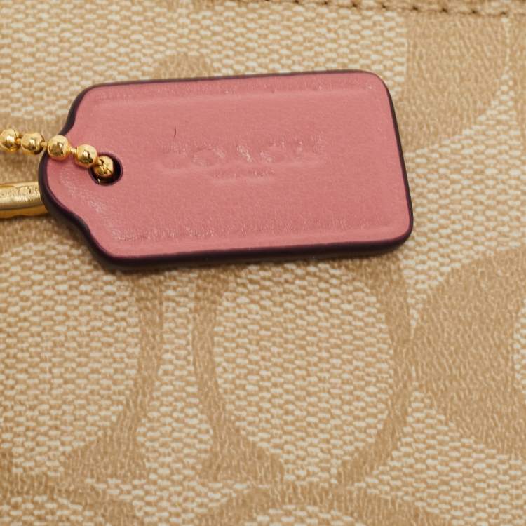 Pre Owned Coach Beige/Pink Signature Coated Canvas and Leather Double Zip Wristlet Pouch