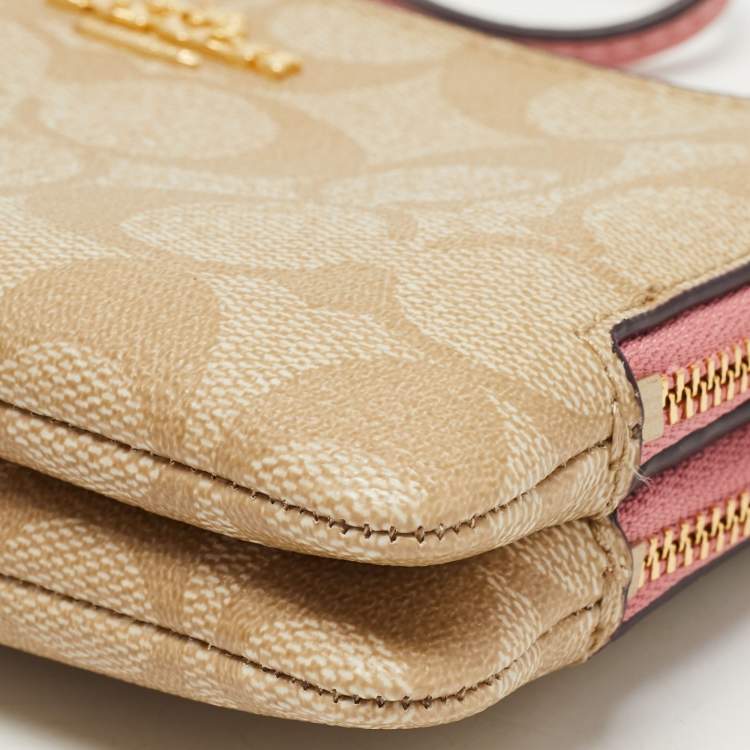 Pre Owned Coach Beige/Pink Signature Coated Canvas and Leather Double Zip Wristlet Pouch