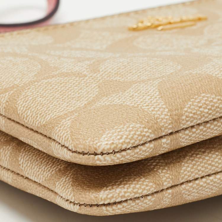 Pre Owned Coach Beige/Pink Signature Coated Canvas and Leather Double Zip Wristlet Pouch