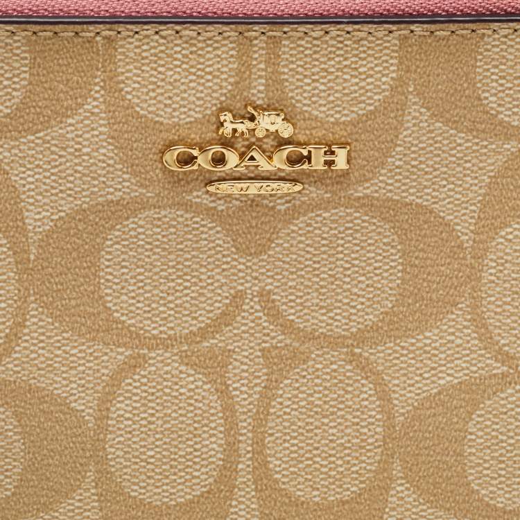 Pre Owned Coach Beige/Pink Signature Coated Canvas and Leather Double Zip Wristlet Pouch