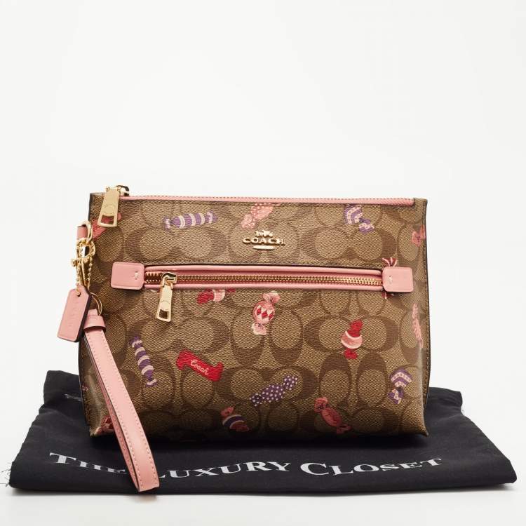 مملوك�ة مسبقًا Coach Beige Signature Coated Canvas and Leather Rowan Wristlet Pouch