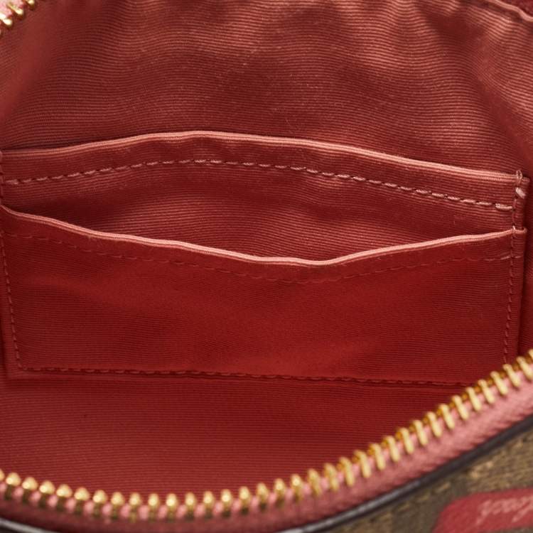 مملوكة مسبقًا Coach Beige Signature Coated Canvas and Leather Rowan Wristlet Pouch