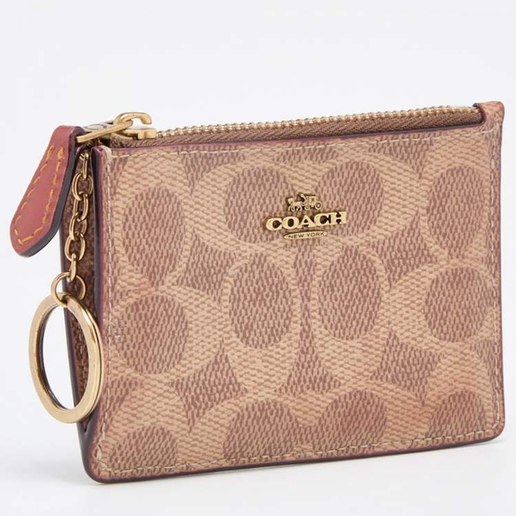 Pre Owned Coach Beige/Brown Signature Coated Canvas and Leather Zip Skinny ID Case