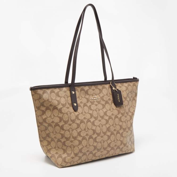 Pre Owned Coach Beige/Brown Signature Coated Canvas and Leather City Zip Tote