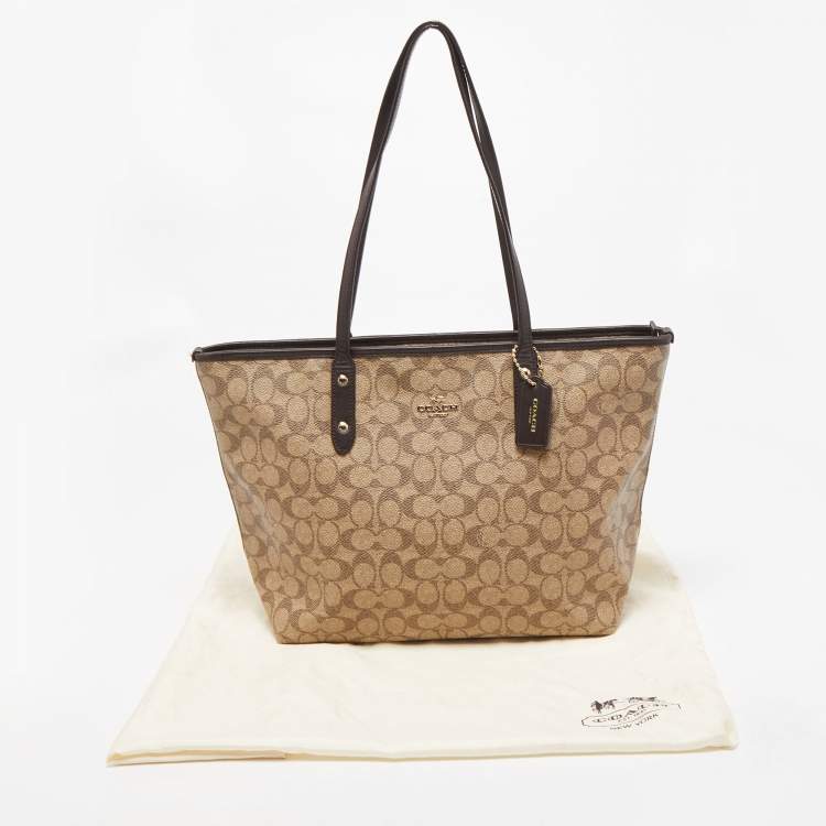 Pre Owned Coach Beige/Brown Signature Coated Canvas and Leather City Zip Tote