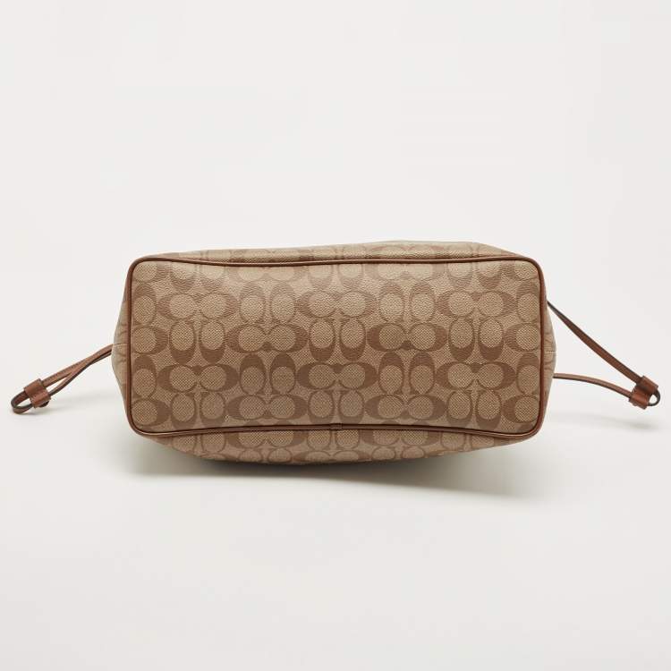 Pre Owned Coach Beige Signature Coated Canvas and Leather Drawstring Carryall Satchel