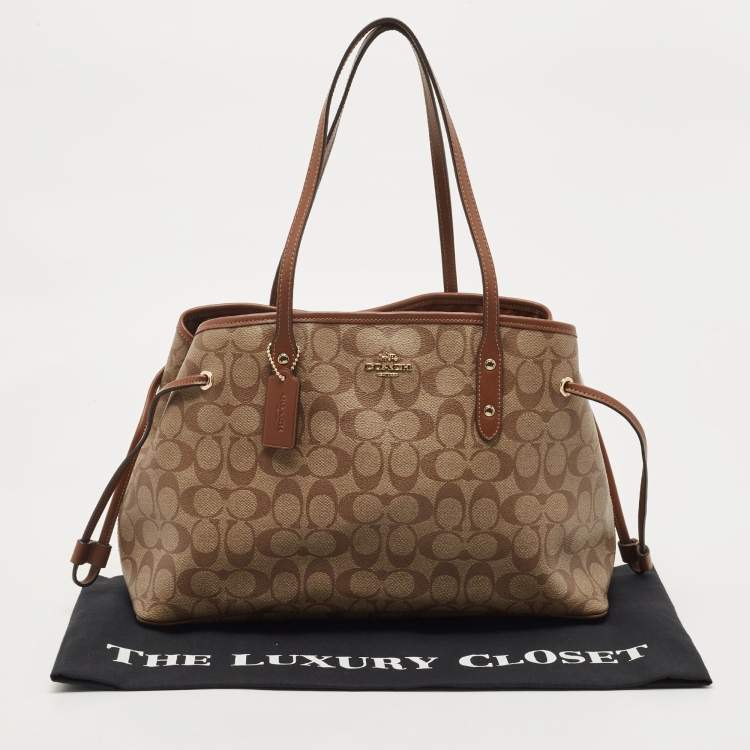 Pre Owned Coach Beige Signature Coated Canvas and Leather Drawstring Carryall Satchel