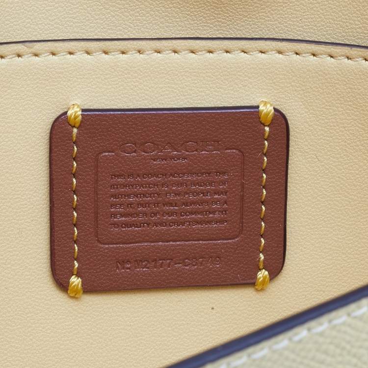 Pre Owned Coach Yellow Leather Wyn Flap Crossbody Bag