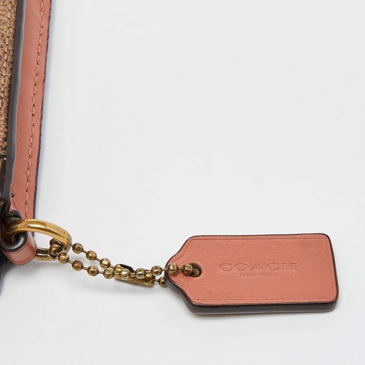 Pre Owned Coach Beige/Peach Signature Coated Canvas and Leather Noa Pop Up Crossbody Bag