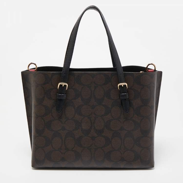Pre Owned Coach Brown/Black Signature Coated Canvas Tatum Caryall Tote