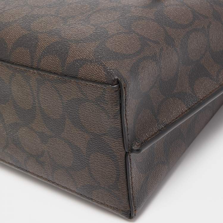 Pre Owned Coach Brown/Black Signature Coated Canvas Tatum Caryall Tote